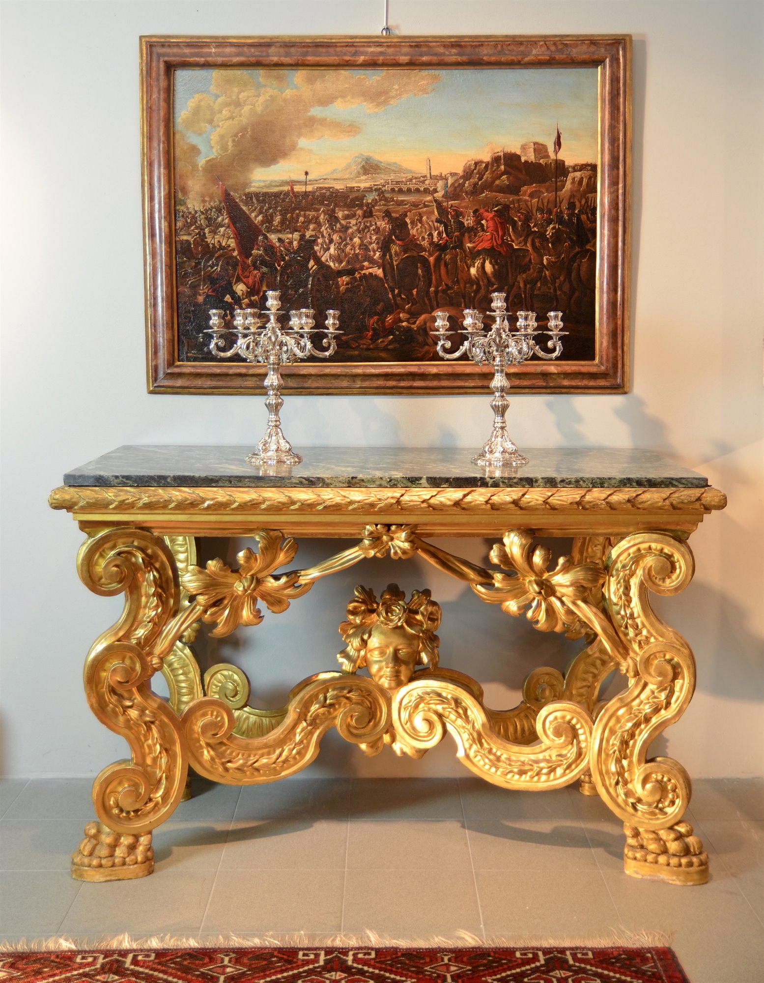 Importante consolle Luigi XIV, in legno intagliato, scolpito e dorato