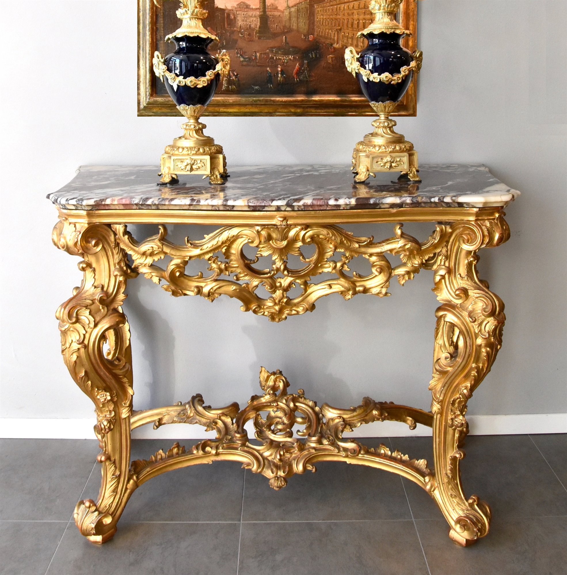 Importante consolle Luigi XV, in legno intagliato, scolpito e dorato