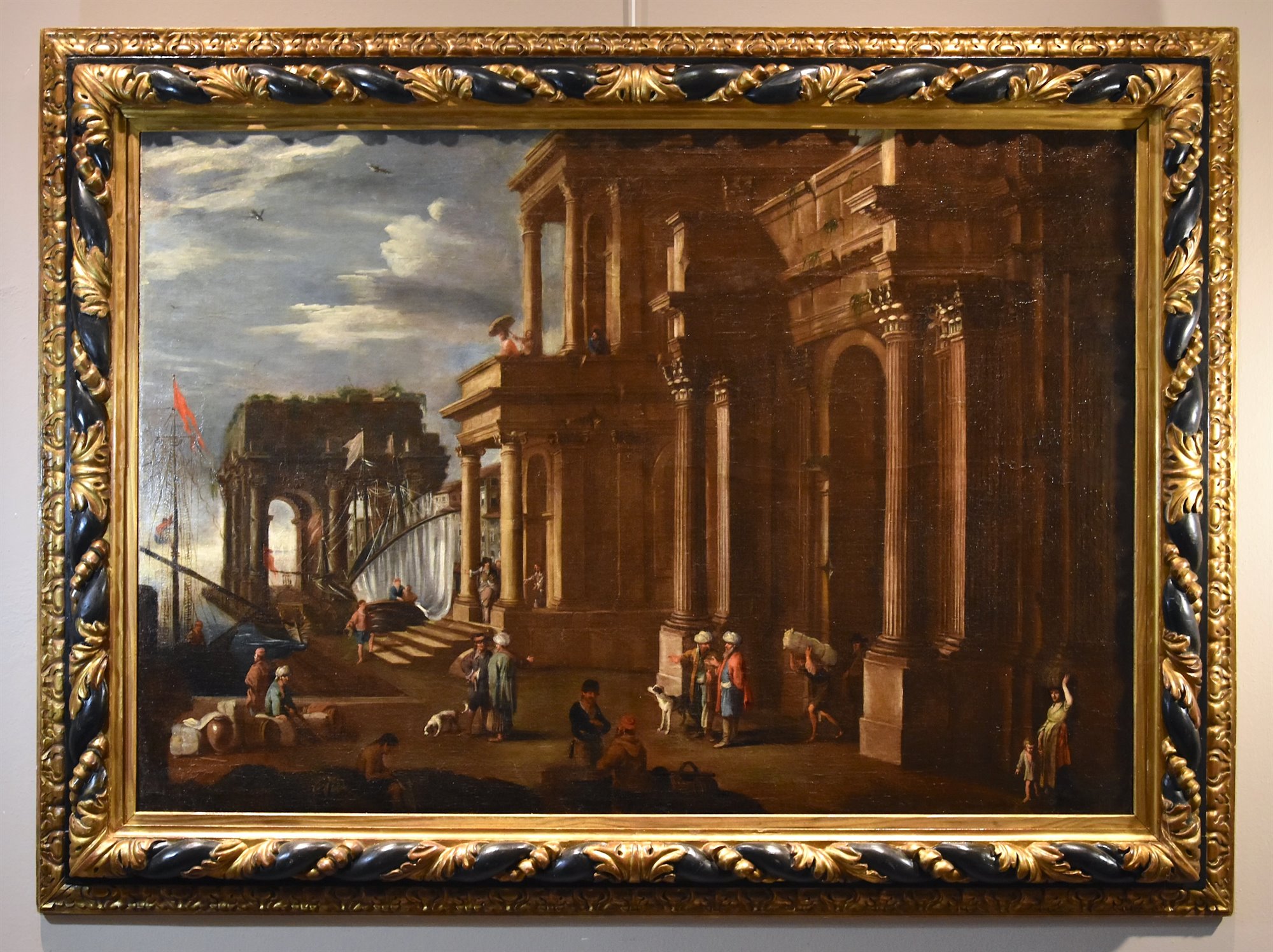 Veduta fantastica con porto e capriccio architettonico