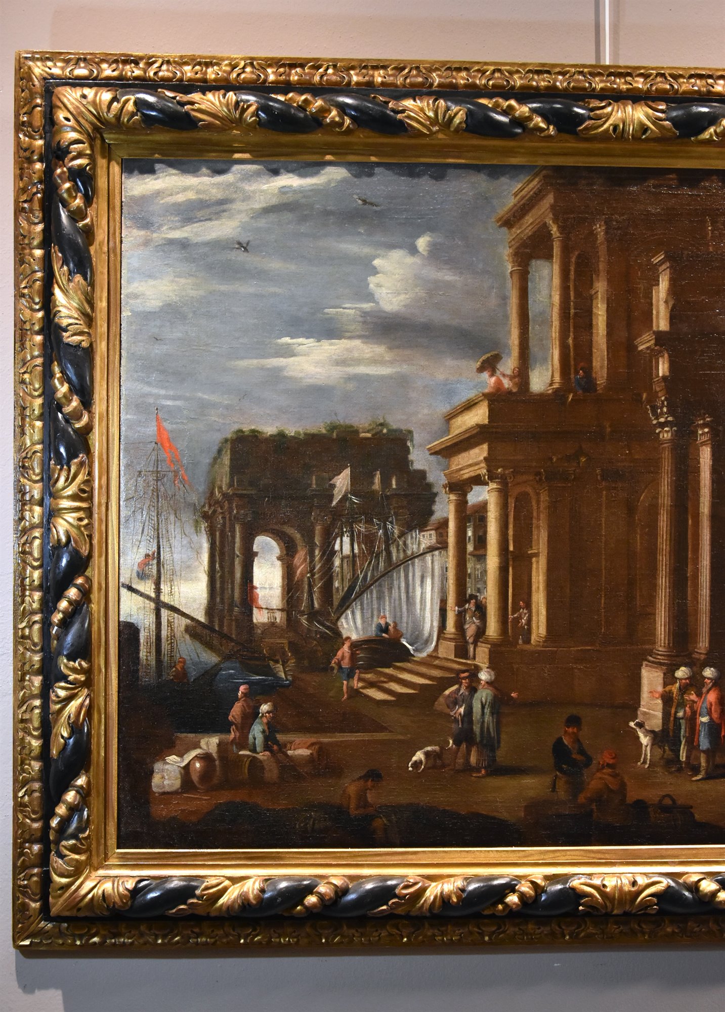 Veduta fantastica con porto e capriccio architettonico
