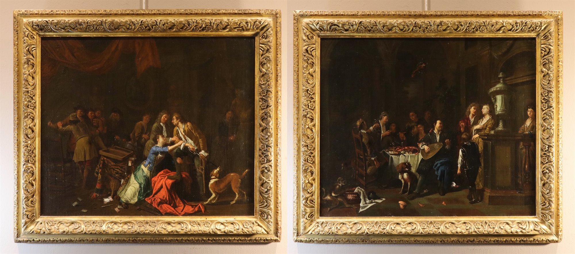 Coppia di interni con scende di genere 'Banchetto' e 'Rissa'