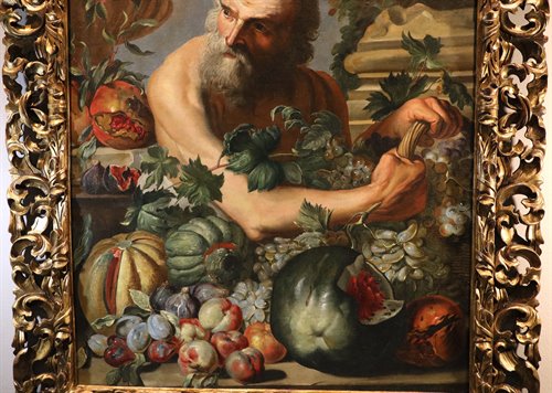 Ritratto del filosofo greco Diogene con composizione di frutta e fiori