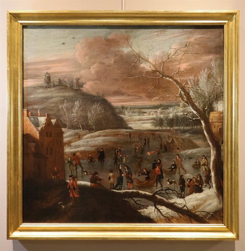 Paesaggio invernale con lago ghiacciato e pattinatori